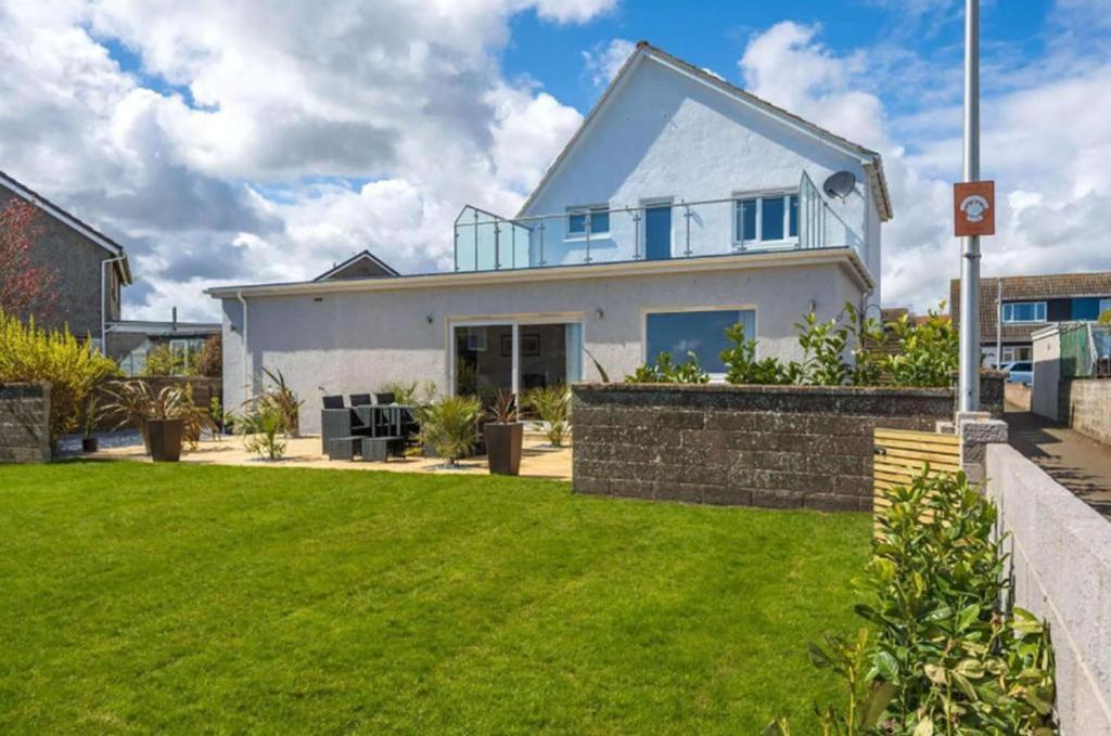 a house with a lawn in front of it at Crail 5 Bedroom Villa in Crail