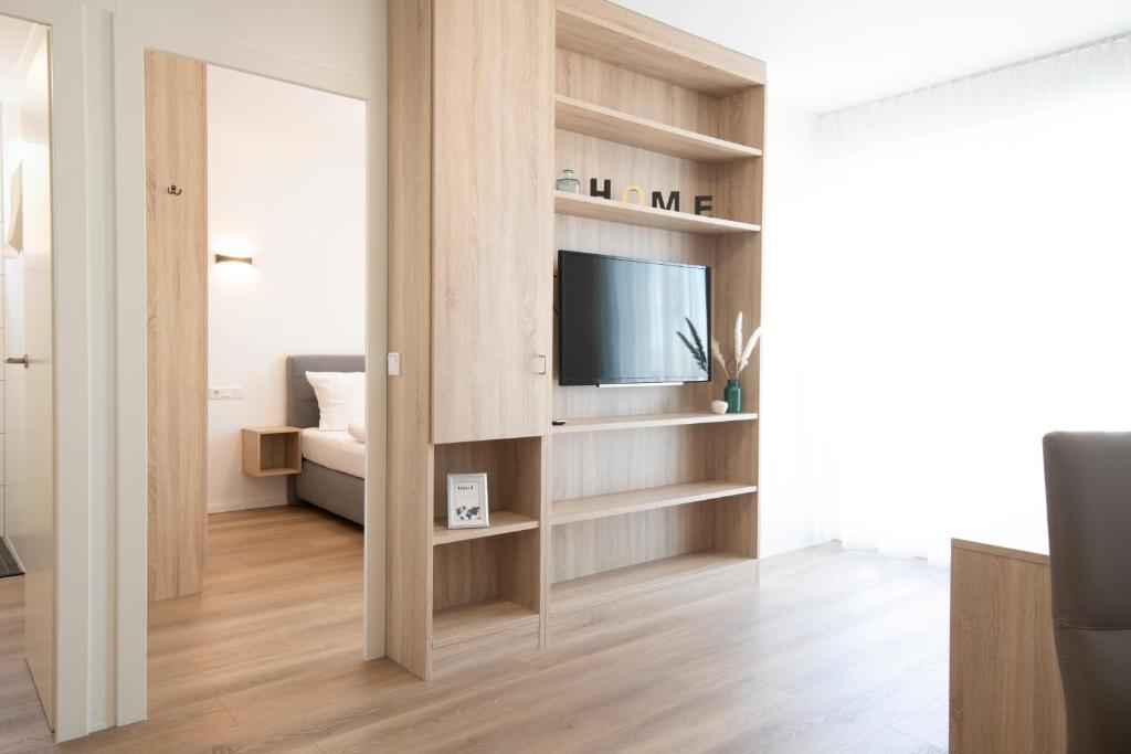 TV a/nebo společenská místnost v ubytování Smart & Stay Aparthotel Saarlouis Lisdorf - Self-Check-In - Free Parking