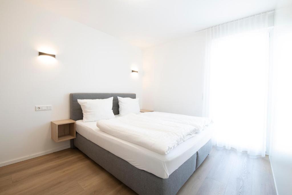 Postel nebo postele na pokoji v ubytování Smart & Stay Aparthotel Saarlouis Lisdorf - Self-Check-In - Free Parking