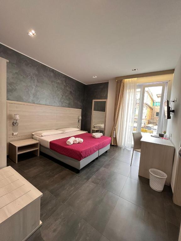 Postel nebo postele na pokoji v ubytování B&B Margherita