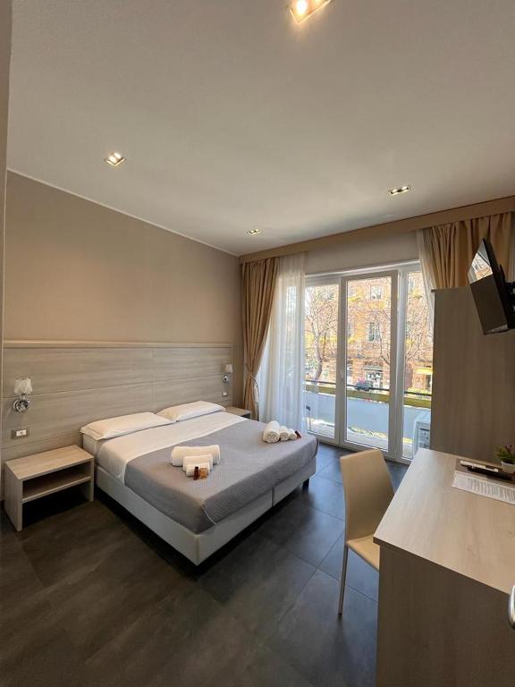 Postel nebo postele na pokoji v ubytování B&B Margherita