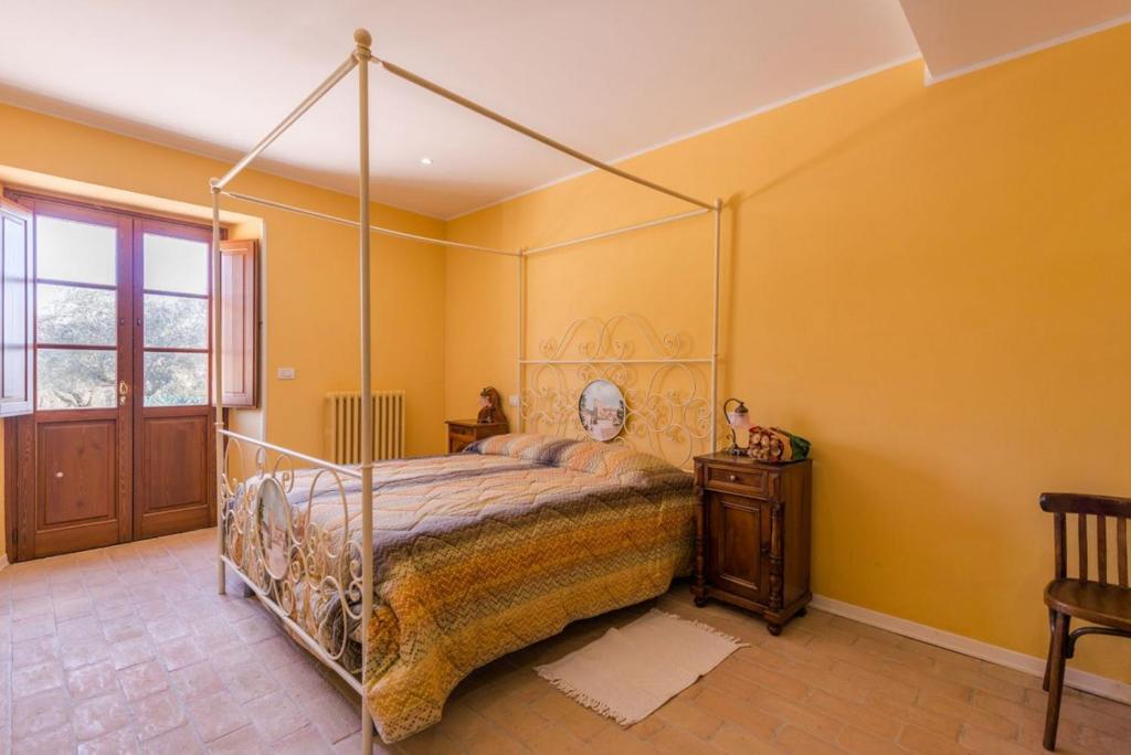 Posteľ alebo postele v izbe v ubytovaní Agriturismo Le Case Rosse di Montebuono
