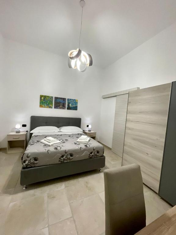 Łóżko lub łóżka w pokoju w obiekcie B&B La Piazzetta