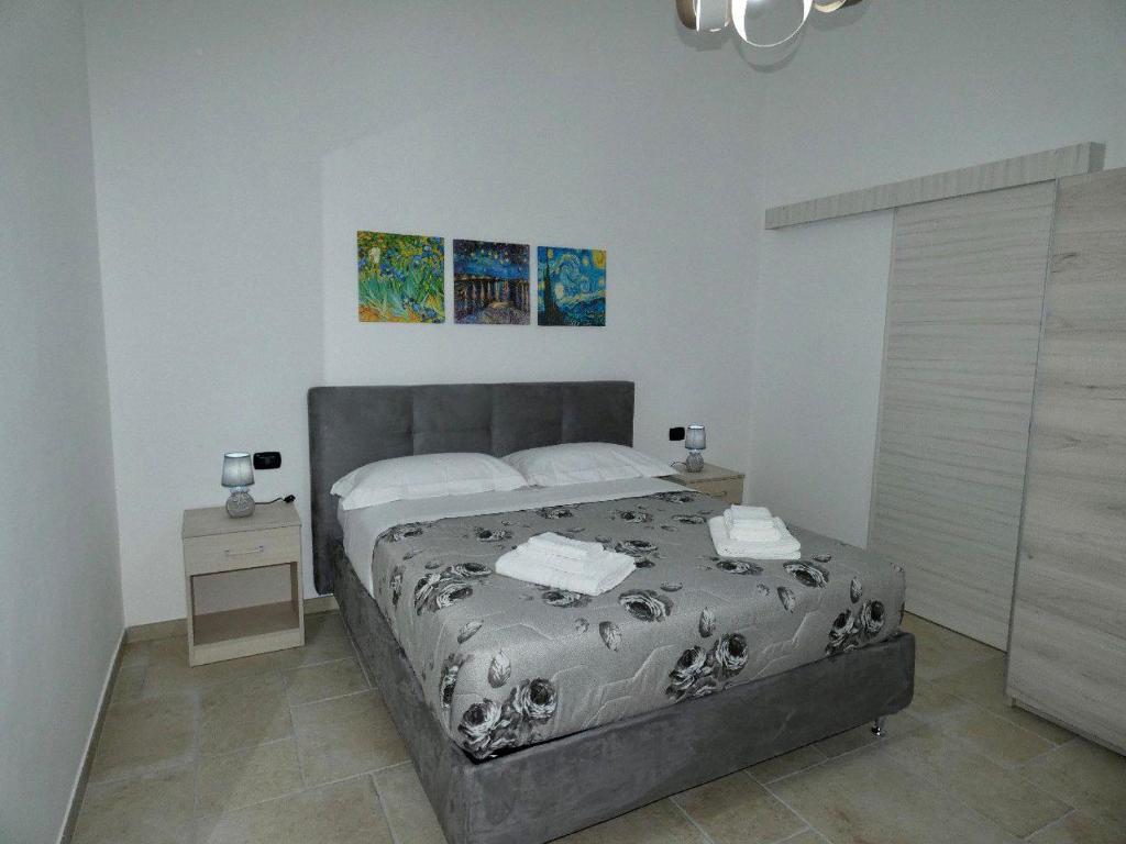 Łóżko lub łóżka w pokoju w obiekcie B&B La Piazzetta