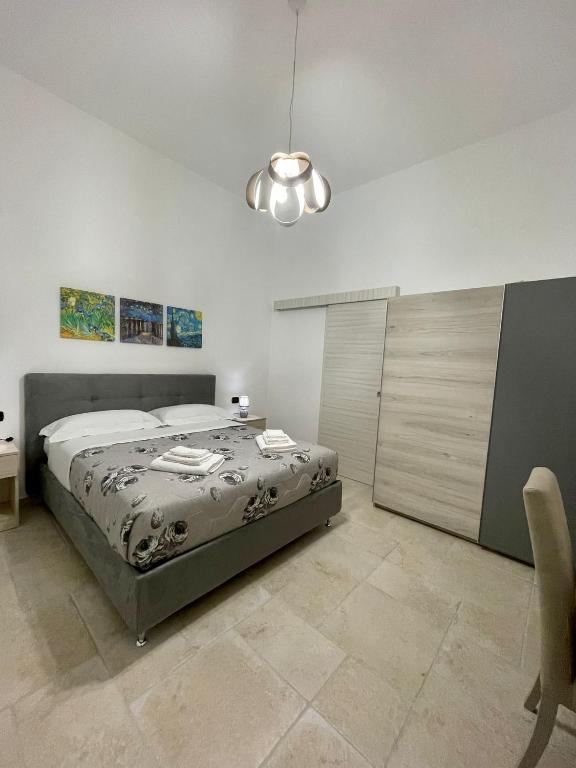 Łóżko lub łóżka w pokoju w obiekcie B&B La Piazzetta