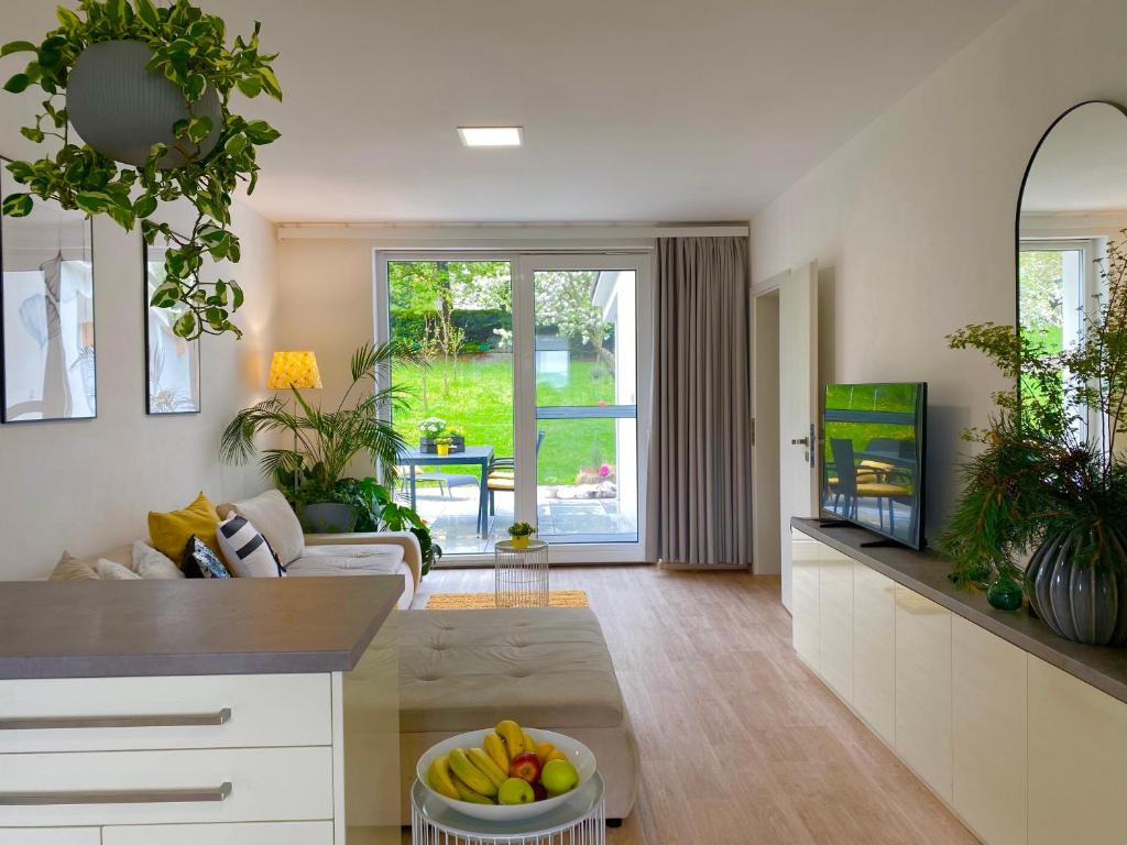 a living room with a couch and a tv at Brunetti Villa Zlín in Zlín