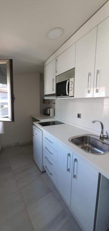 Kuchyň nebo kuchyňský kout v ubytování Apartamentos Torre de la Mezquita