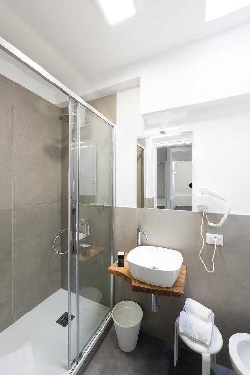 a bathroom with a glass shower and a sink at Boutique Hotel Nuovo Cason in Cavallino-Treporti