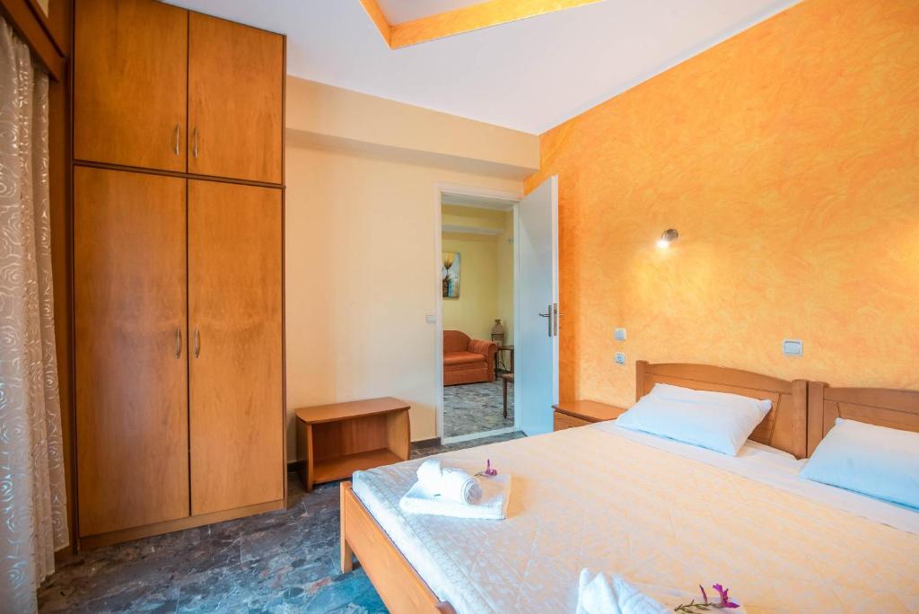 A bed or beds in a room at Bozikis Apartments