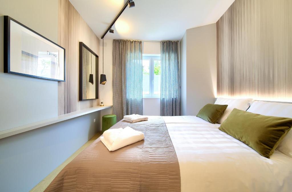 Posteľ alebo postele v izbe v ubytovaní Apartment DIAMAR with seaview