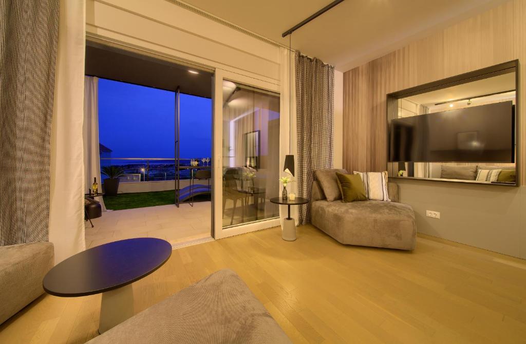 Televízia a/alebo spoločenská miestnosť v ubytovaní Apartment DIAMAR with seaview