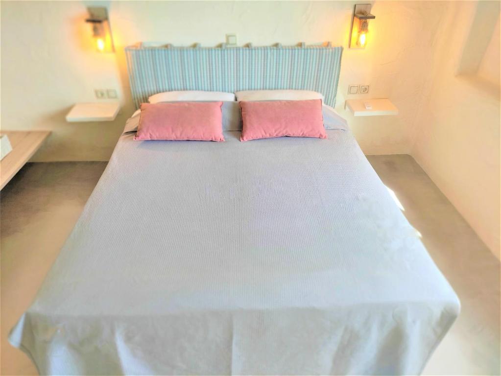 Postel nebo postele na pokoji v ubytování Mosaic Suites