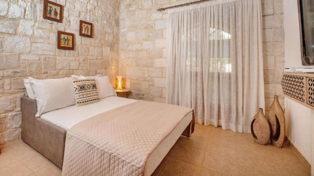 Postel nebo postele na pokoji v ubytování World Villa