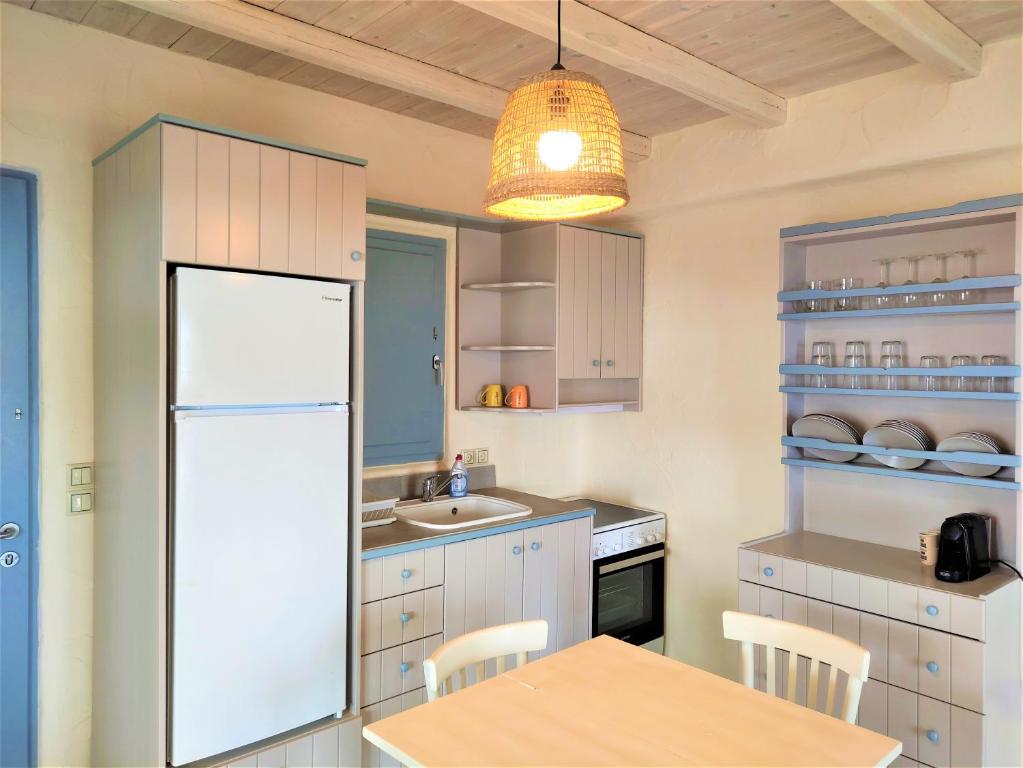 Kuchyň nebo kuchyňský kout v ubytování Mosaic Suites