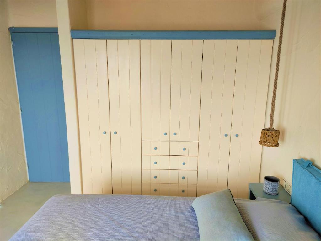 Postel nebo postele na pokoji v ubytování Mosaic Suites