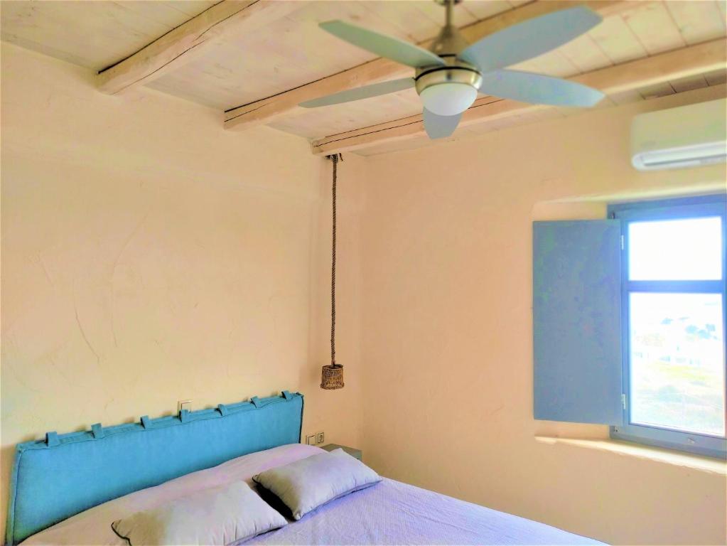 Postel nebo postele na pokoji v ubytování Mosaic Suites