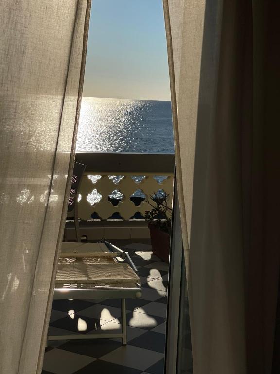 a view of the ocean from a balcony at Locanda Garzelli in Quercianella