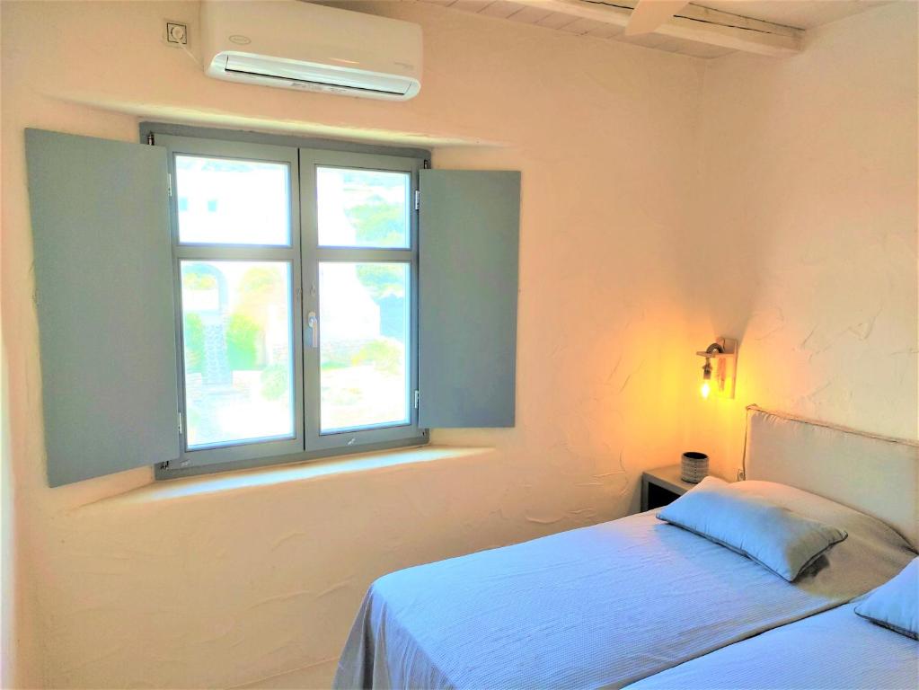 Postel nebo postele na pokoji v ubytování Mosaic Suites