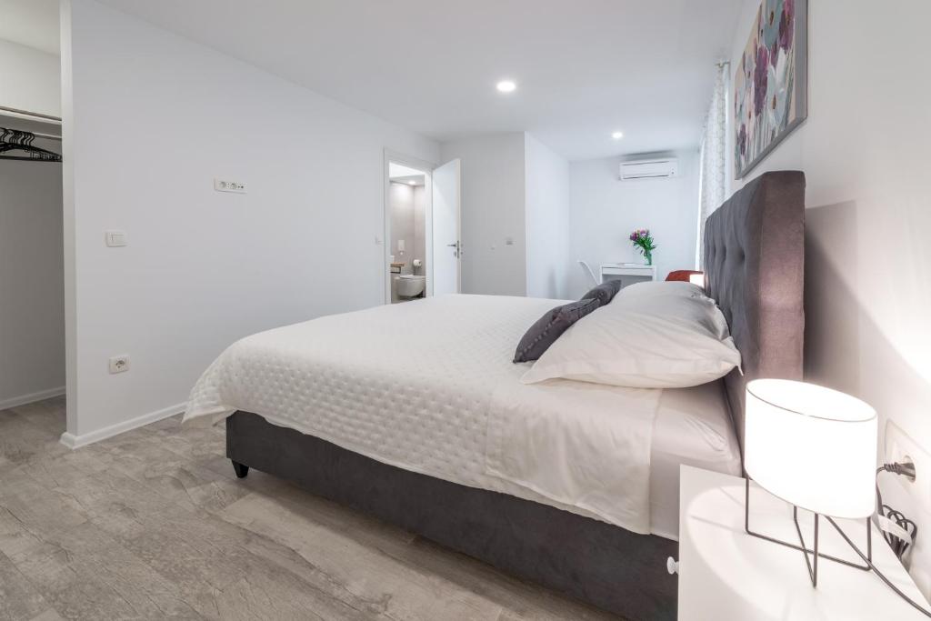 Posteľ alebo postele v izbe v ubytovaní Apartment Promenade