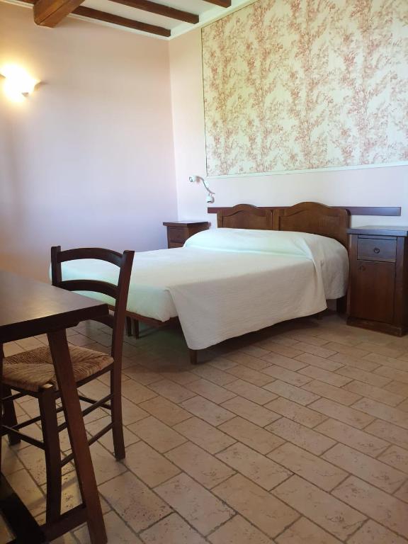 Postel nebo postele na pokoji v ubytování Agriturismo Le Querce