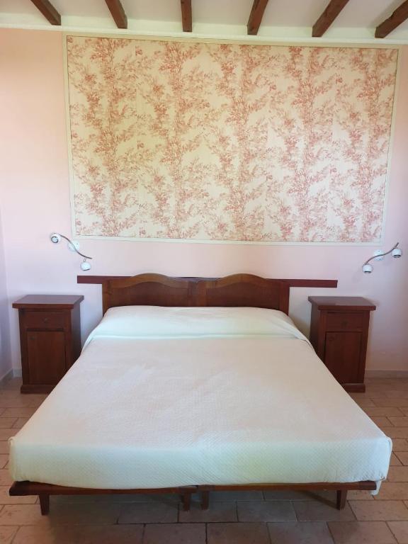 Postel nebo postele na pokoji v ubytování Agriturismo Le Querce