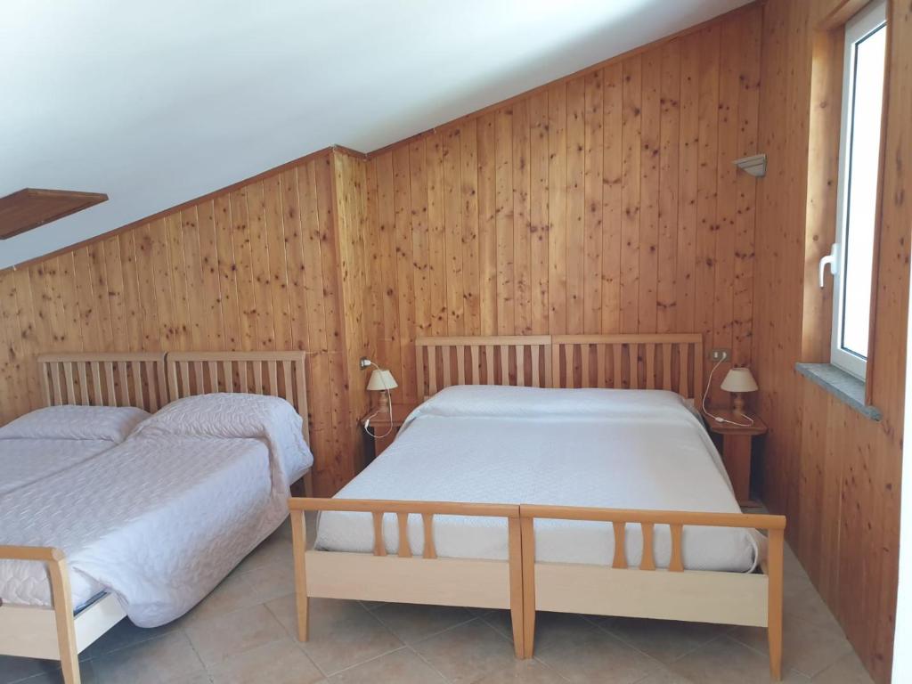 Postel nebo postele na pokoji v ubytování Agriturismo Le Querce