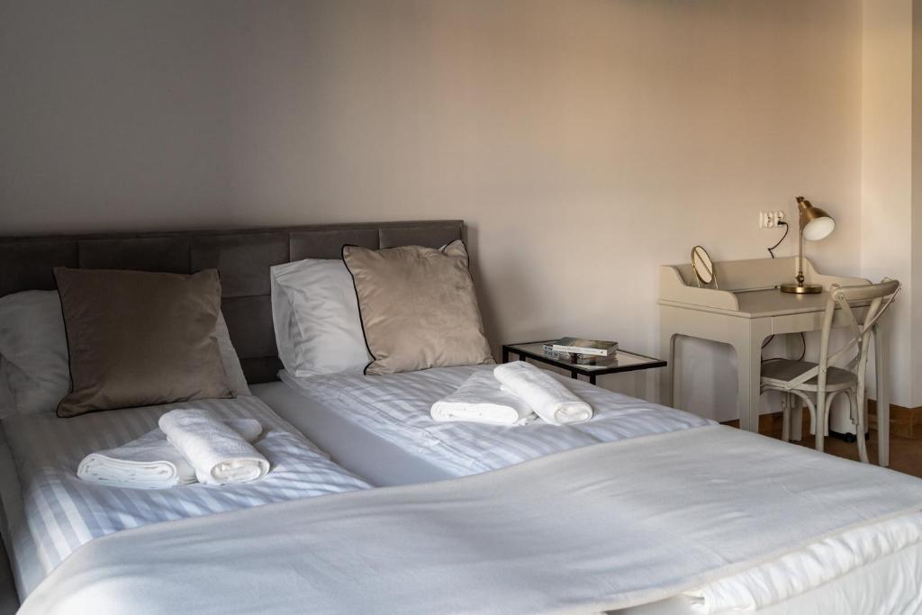Posteľ alebo postele v izbe v ubytovaní Apartamenty Przystanek Przy Klifie
