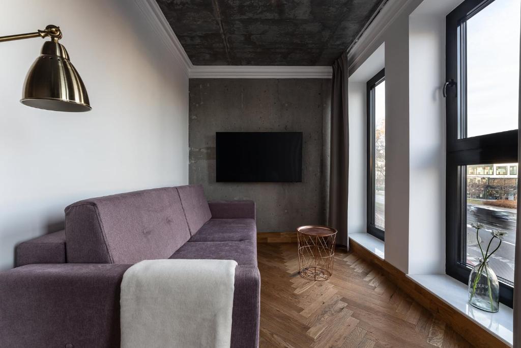Televízia a/alebo spoločenská miestnosť v ubytovaní Apartamenty Przystanek Przy Klifie