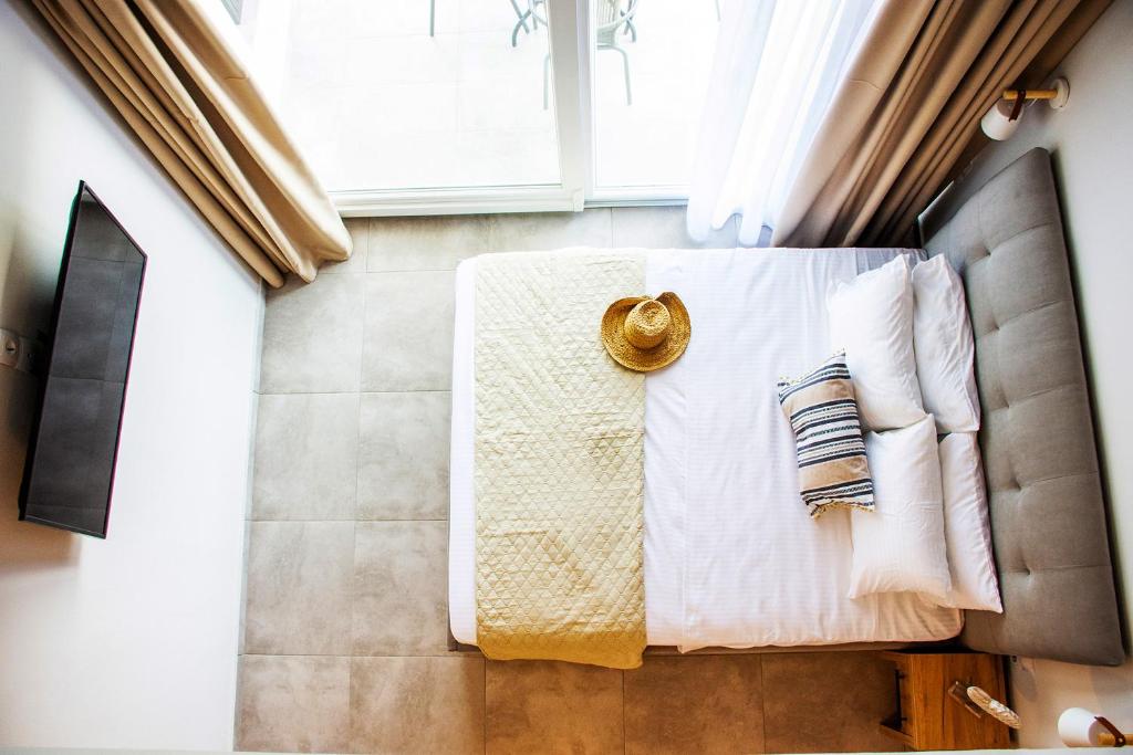 Posteľ alebo postele v izbe v ubytovaní Sithon Diamond Suites