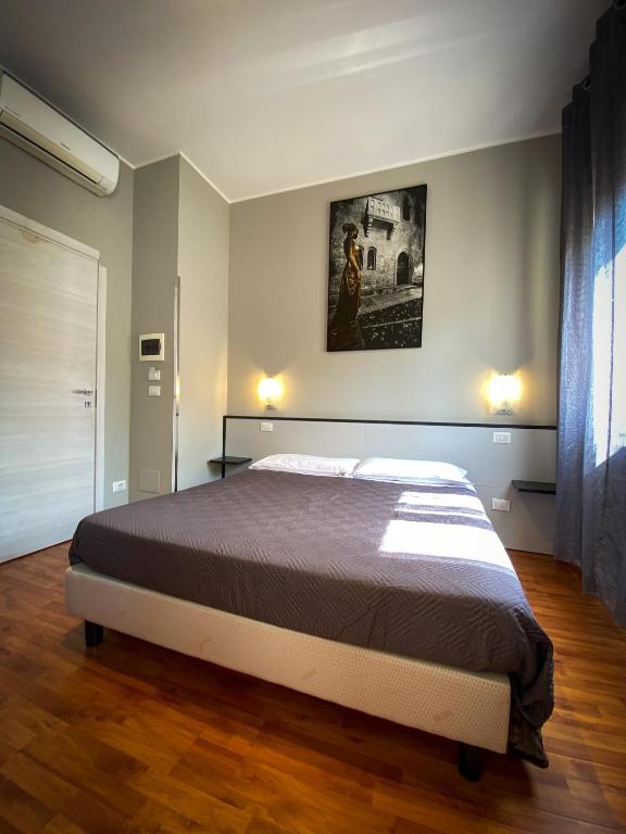 Postel nebo postele na pokoji v ubytování Hotel Arena