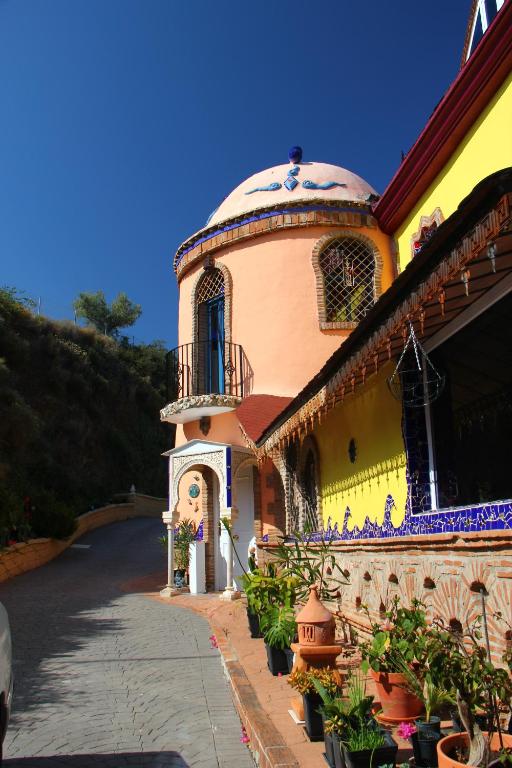 a building with a dome on top of it at Casa Paraiso in Benajarafe