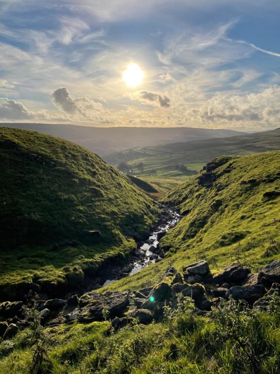 a view of a valley with a river on a hill at The White Lion Inn in Buckden