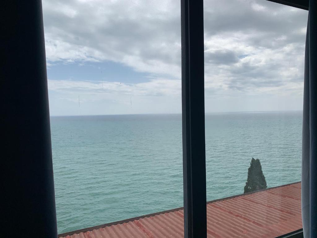 a view of the ocean from a window at Luna Convento Copanello B&B in Stalettì