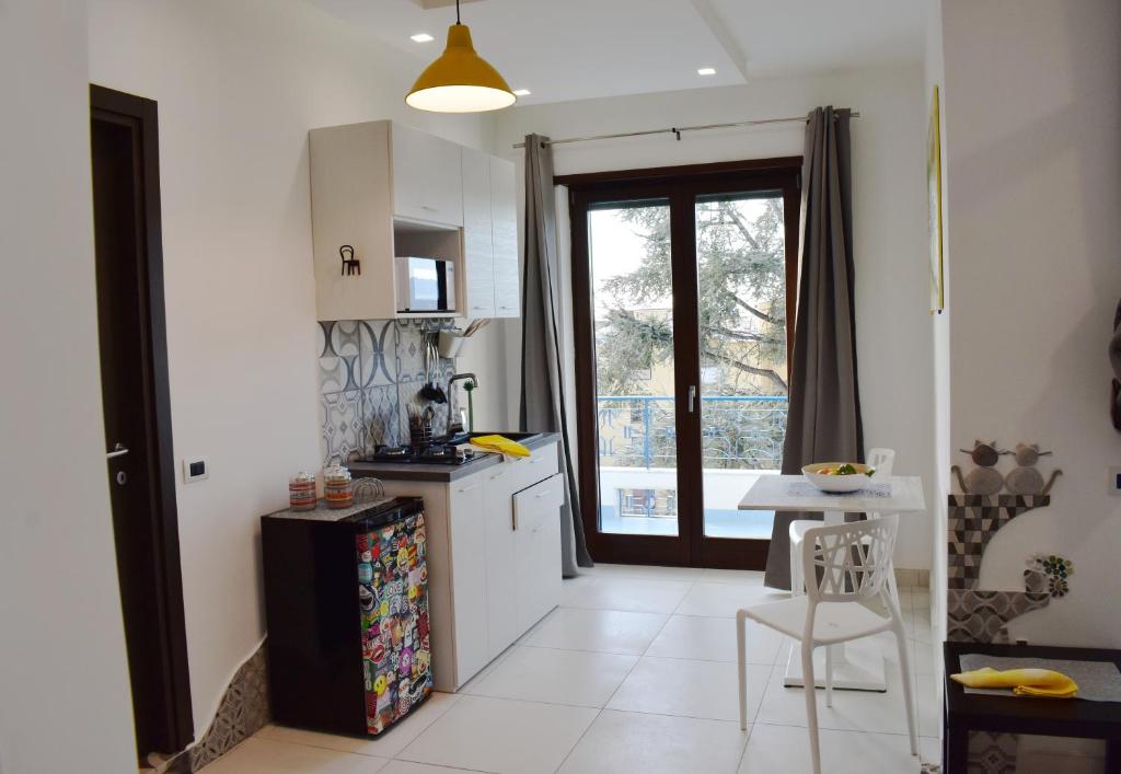 Kuchyň nebo kuchyňský kout v ubytování Lume Art Apartment B&B