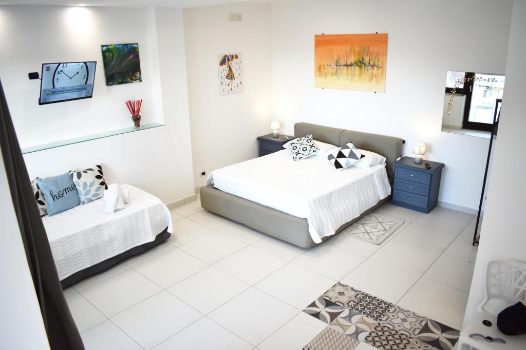 Postel nebo postele na pokoji v ubytování Lume Art Apartment B&B