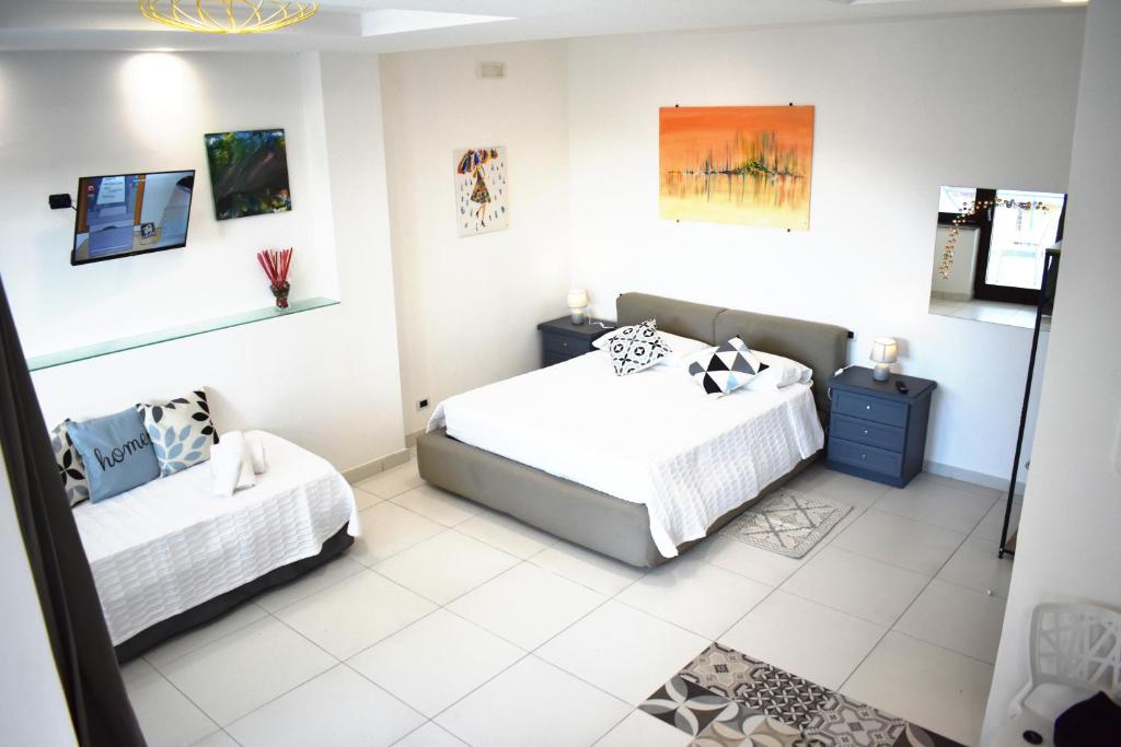 Postel nebo postele na pokoji v ubytování Lume Art Apartment B&B