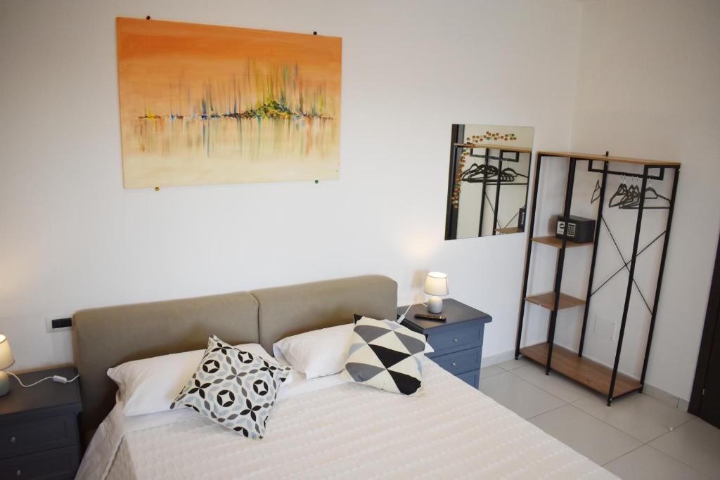 Postel nebo postele na pokoji v ubytování Lume Art Apartment B&B
