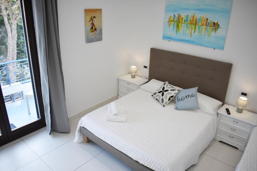 Postel nebo postele na pokoji v ubytování Lume Art Apartment B&B