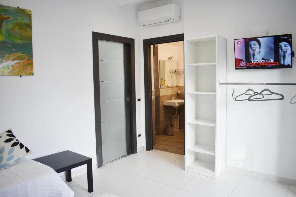 TV a/nebo společenská místnost v ubytování Lume Art Apartment B&B