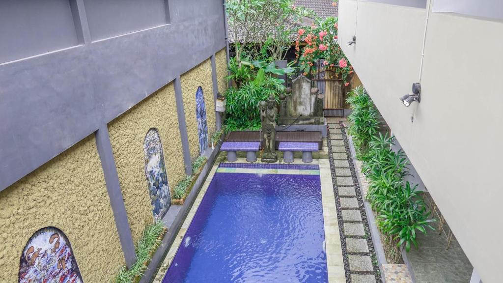 Bazén v ubytování Pondok Pekak Guesthouse nebo v jeho okolí