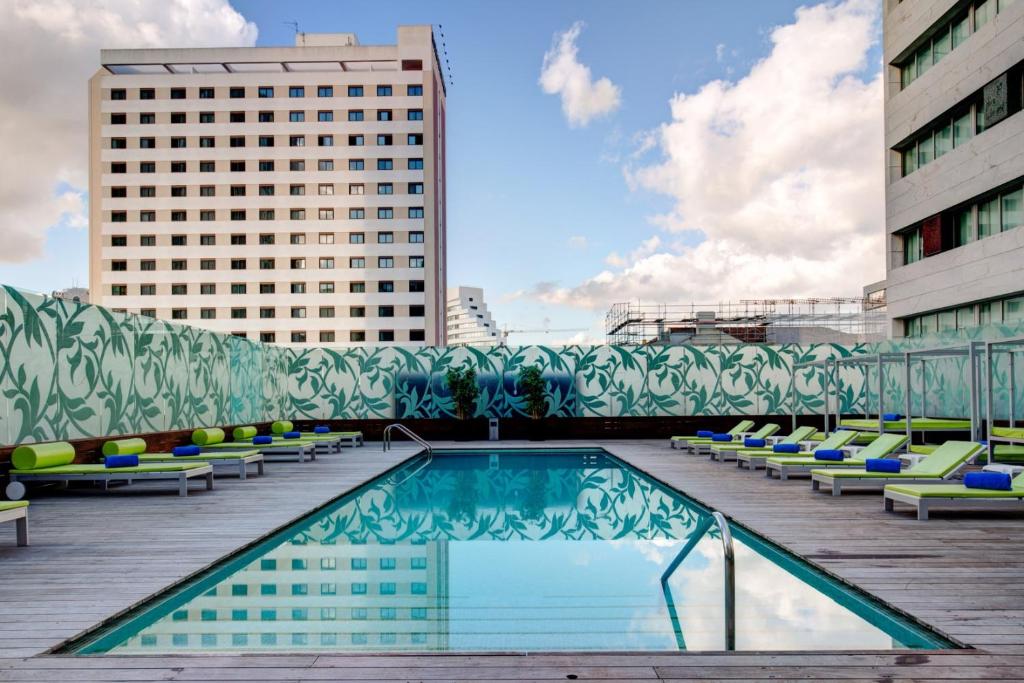 a pool on the roof of a building at VIP Grand Lisboa Hotel & Spa in Lisbon