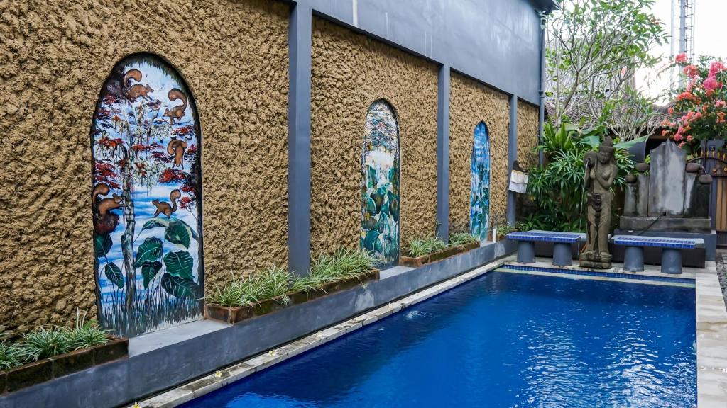 Bazén v ubytování Pondok Pekak Guesthouse nebo v jeho okolí