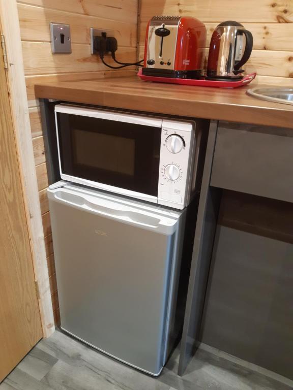Kuchyň nebo kuchyňský kout v ubytování Loch Caroy Pods