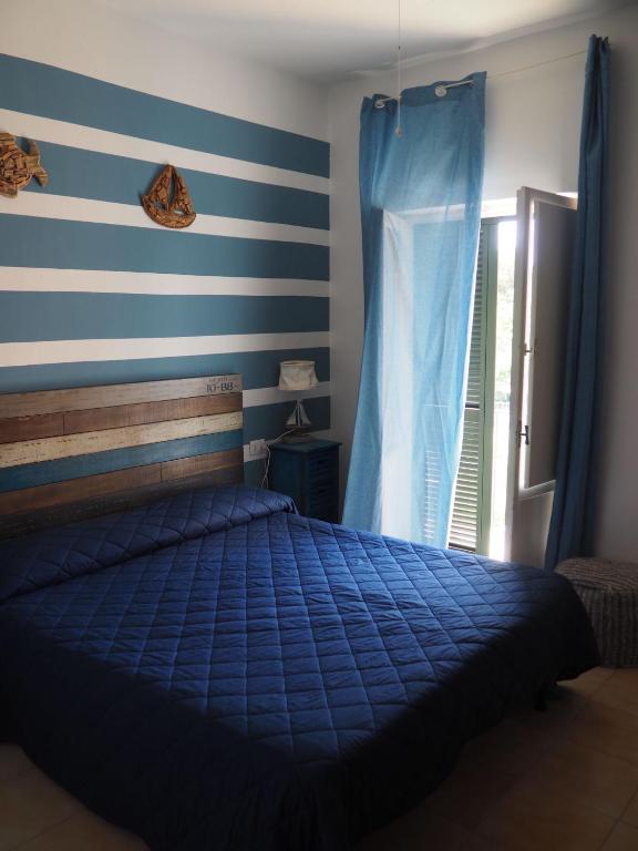 Postel nebo postele na pokoji v ubytování Il Vecchio e Il Mare Maratea