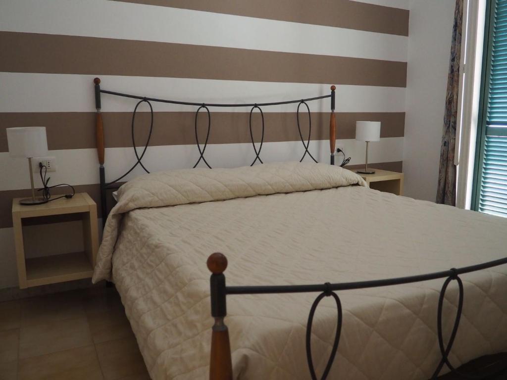 Postel nebo postele na pokoji v ubytování Il Vecchio e Il Mare Maratea
