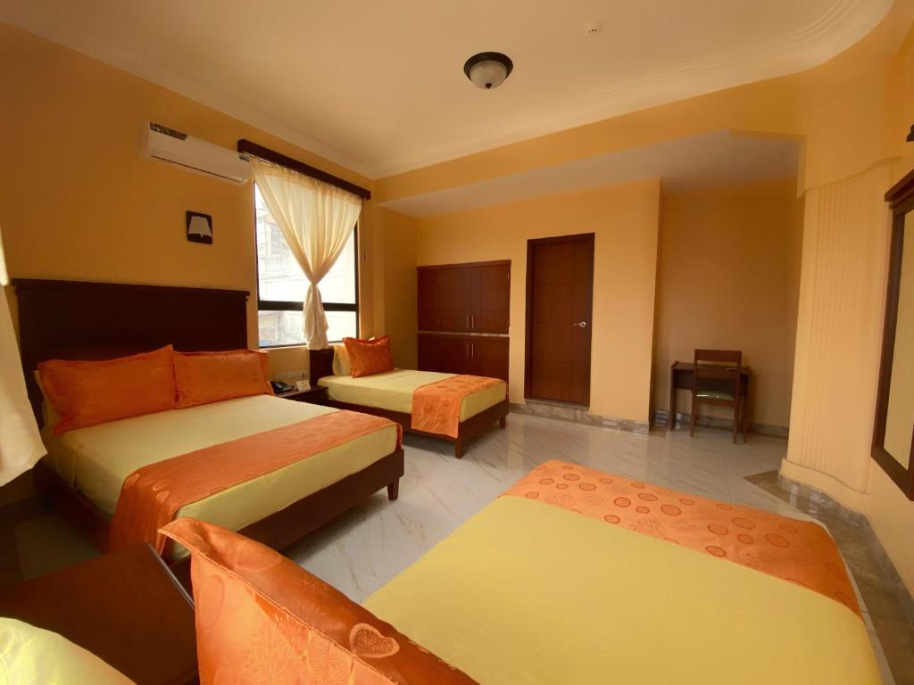 Postel nebo postele na pokoji v ubytování Hostal California Inn