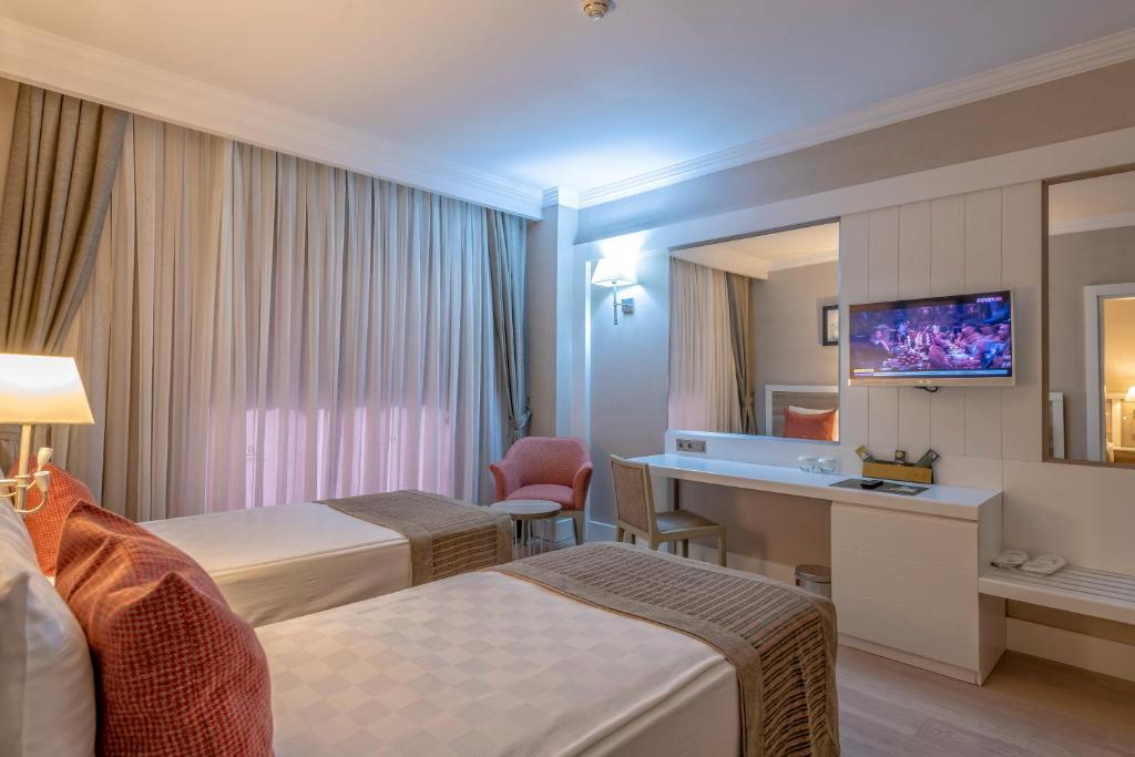 TV a/nebo společenská místnost v ubytování Port River Hotel&Spa