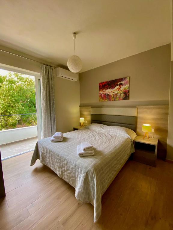 Posteľ alebo postele v izbe v ubytovaní Eirini & Manolis Apartments