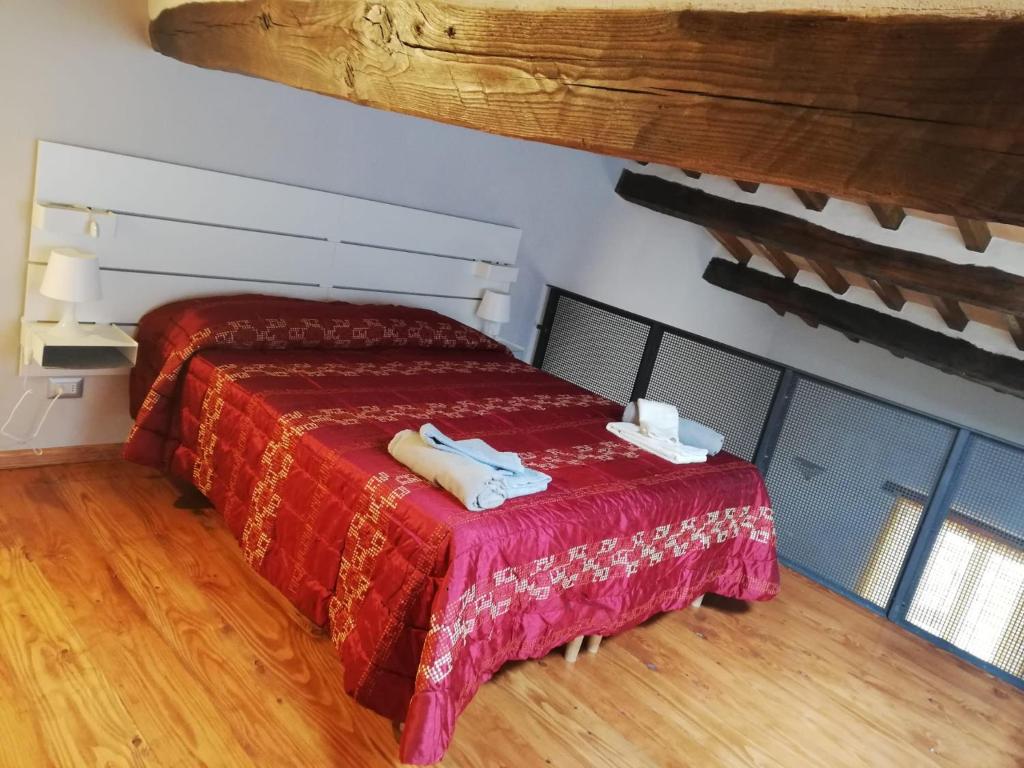 Postel nebo postele na pokoji v ubytování Casetta di Ghino