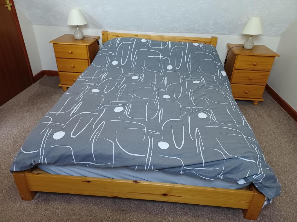 Postel nebo postele na pokoji v ubytování Dunroaming Cottage